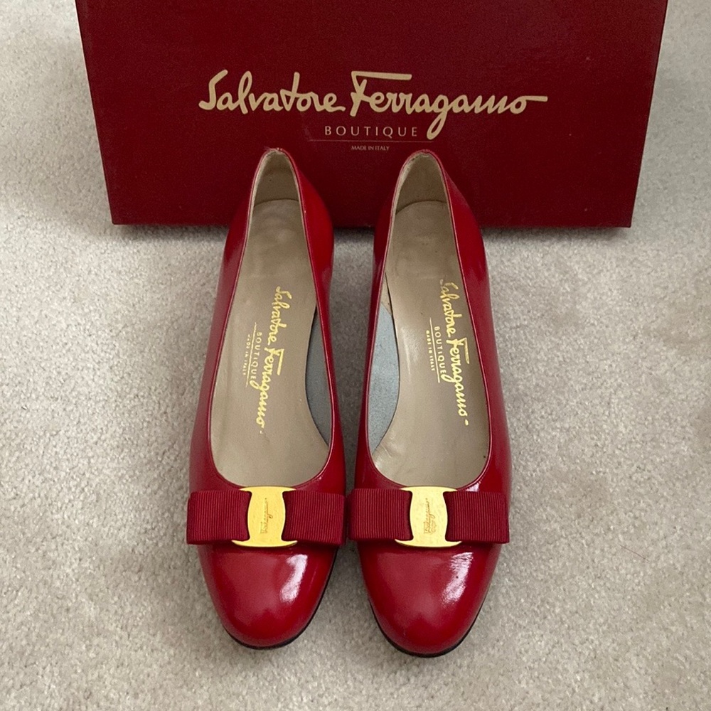 FERRAGAMO RED PATENT LEATHER sz 7 1/2B. Round toe with bows & signature hardware